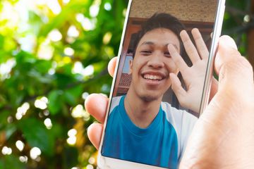 Cropped Hand Doing Video Call With Friend