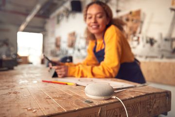 Woman speaking to smart speaker