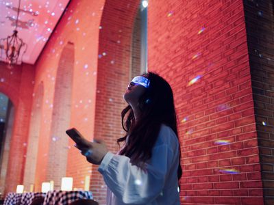 A child using VR glasses in a ballroom.