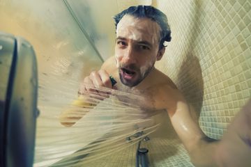 Man singing in shower.