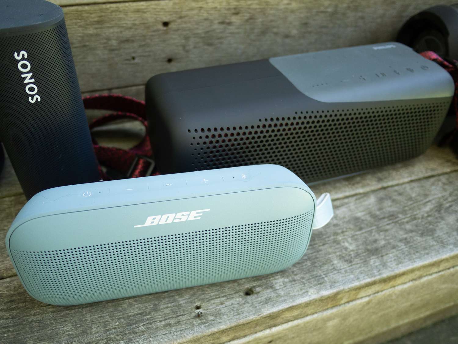 Bose SoundLink Flex, Soundcore Motion X600, and Ultimate Ears Hyperboom speakers.