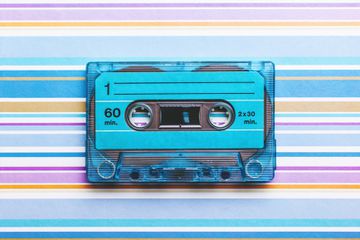 Cassette tape on colored background