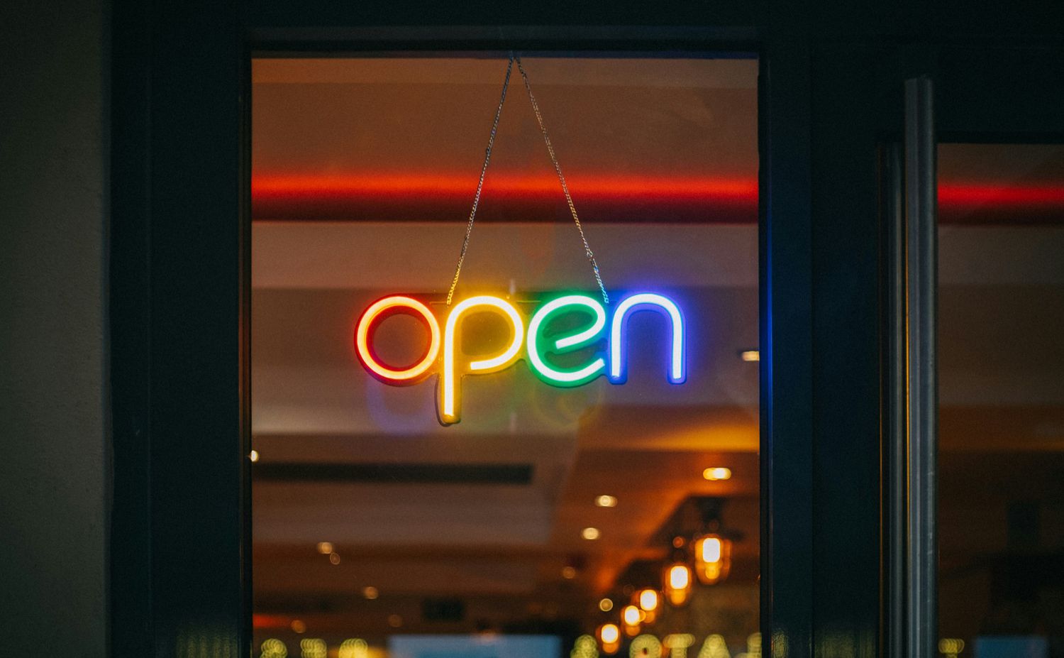 Neon sign that reads 'Open.'