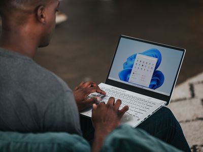 Man using Windows 11 laptop