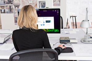 Woman updating Zoom on her desktop PC.